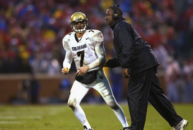 NORMAN, OK - NOVEMBER 2:  Quarterback Robert Hodge #7 of the Colorado Buffaloes gets instruction by Wide Receivers coach Jon Embree during the game against the Oklahoma Sooners at Memorial Stadium on November 2, 2002 in Norman, Oklahoma.  The Sooners won 27-11.  (Photo by Ronald Martinez/Getty Images)