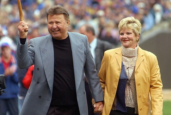 CHICAGO - SEPTEMBER 28:  Former Chicago Cub third baseman Ron Santo and his wife Vicki walk onto the field before a retirement ceremony for Santo's uniform number 10 before a game against the Pittsburgh Pirates on September 28, 2003 at Wrigley Field in Chicago, Illinois.  The Pirates defeated the Cubs 3-2.  (Photo by Jonathan Daniel/Getty Images)