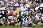 GLENDALE, AZ - NOVEMBER 29:  Runningback Anthony Dixon #1 of the San Francisco 49ers dives into the endzone to score on a 1 yard rushing touchdown against the Arizona Cardinals during the first quarter of the NFL game at the University of Phoenix Stadium on November 29, 2010 in Glendale, Arizona.  (Photo by Christian Petersen/Getty Images)