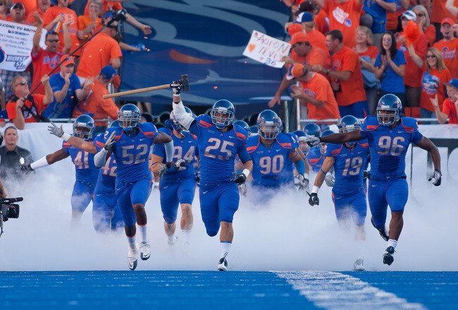 BOISE, ID - SEPTEMBER 25:  Linebacker Billy Derome #25 of the Boise State Broncos leads his team onto the field before the game against the Oregon State Beavers at Bronco Stadium on September 25, 2010 in Boise, Idaho.  (Photo by Otto Kitsinger III/Getty Images)