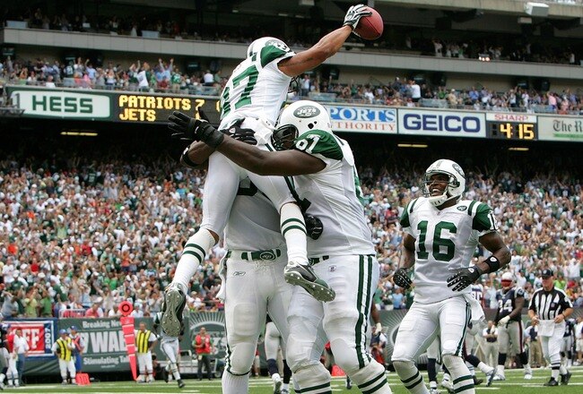 EAST RUTHERFORD, NJ - SEPTEMBER 09:  Laveranues Coles #87 of the New York Jets is lifted by his teammates after running in a touchdown against the New England Patriots on September 9, 2007 at Giants Stadium in East Rutherford, New Jersey.  (Photo by Nick Laham/Getty Images)