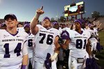 ALBUQUERQUE, NM - NOVEMBER 27: TCU Horned Frogs quarterback Andy Dalton #14, center Jake Kirkpatrick #76 and wide receiver Alonzo Adams #81 celebrate their 66-17 win over the University of New Mexico Lobos on November 27, 2010 at University Stadium in Albuquerque, New Mexico. (Photo by Eric Draper/Getty Images)