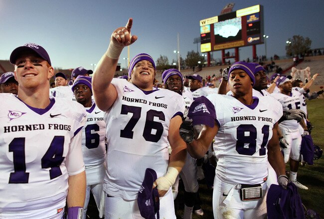 ALBUQUERQUE, NM - NOVEMBER 27: TCU Horned Frogs quarterback Andy Dalton #14, center Jake Kirkpatrick #76 and wide receiver Alonzo Adams #81 celebrate their 66-17 win over the University of New Mexico Lobos on November 27, 2010 at University Stadium in Albuquerque, New Mexico. (Photo by Eric Draper/Getty Images)