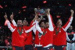 BELGRADE, SERBIA - DECEMBER 05:  Bogdan Obradovic, Nenad Zimonjic, Novak Djokovic, Janko Tipsarevic and Viktor Troicki of Serbia celebrate with the trophy after defeating France during day three of the Davis Cup Tennis Final at the Begrade Arena on December 5, 2010 in Belgrade, Serbia.  (Photo by Julian Finney/Getty Images)