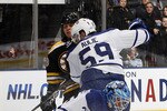 TORONTO, CANADA - DECEMBER 4: Jean-Sebastien Giguere #35 of the Toronto Maple Leafs stops the puck in front of Nathan Horton #18 of the Boston Bruins and Keith Aulie #59 during game action at the Air Canada Centre December 4, 2010 in Toronto, Ontario, Canada. (Photo by Abelimages / Getty Images)