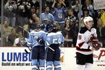 PITTSBURGH, PA - DECEMBER 06:  Sidney Crosby #87 of the Pittsburgh Penguins celebrates his goal with teammates against the New Jersey Devils at Consol Energy Center on December 6, 2010 in Pittsburgh, Pennsylvania.  (Photo by Justin K. Aller/Getty Images)