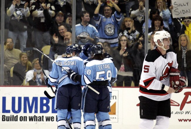 PITTSBURGH, PA - DECEMBER 06:  Sidney Crosby #87 of the Pittsburgh Penguins celebrates his goal with teammates against the New Jersey Devils at Consol Energy Center on December 6, 2010 in Pittsburgh, Pennsylvania.  (Photo by Justin K. Aller/Getty Images)