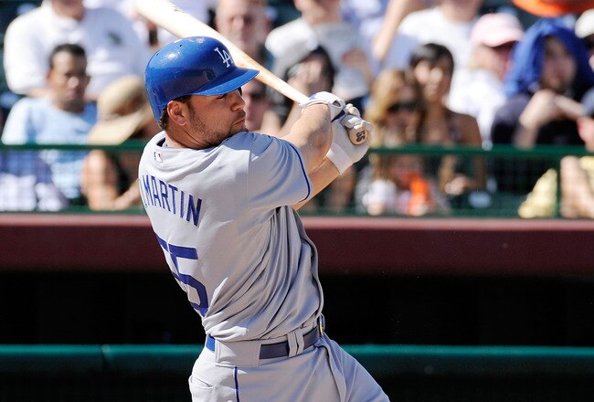 SCOTTSDALE, AZ - FEBRUARY 26:  Russel Martin #55 of the Los Angeles Dodgers hits a two run double against the San Francisco Giants during a spring training game at Scottsdale Stadium on February 26, 2009 in Scottsdale, Arizona.  (Photo by Kevork Djansezian/Getty Images)