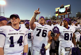 ALBUQUERQUE, NM - NOVEMBER 27: TCU Horned Frogs quarterback Andy Dalton #14, center Jake Kirkpatrick #76 and wide receiver Alonzo Adams #81 celebrate their 66-17 win over the University of New Mexico Lobos on November 27, 2010 at University Stadium in Albuquerque, New Mexico. (Photo by Eric Draper/Getty Images)