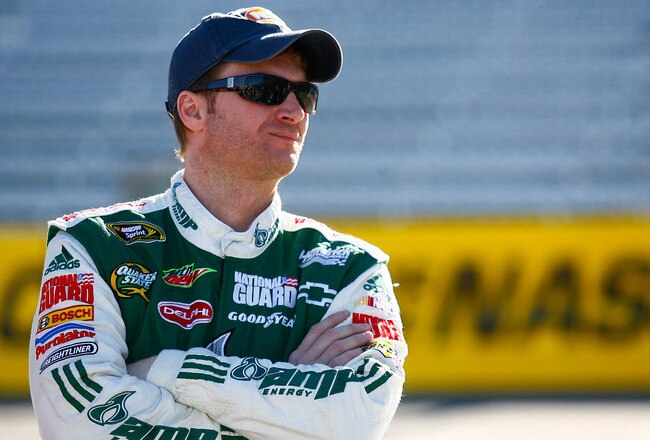 MARTINSVILLE, VA - OCTOBER 22:  Dale Earnhardt Jr., driver of the #88 AMP Energy/National Guard Chevrolet, stands on pit road during qualifying for the NASCAR Sprint Cup Series TUMS Fast Relief 500 at Martinsville Speedway on October 22, 2010 in Martinsville, Virginia.  (Photo by Jason Smith/Getty Images for NASCAR)