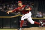 PHOENIX - AUGUST 04:  Relief pitcher D.J. Carrasco #77 of the Arizona Diamondbacks pitches against the Washington Nationals during the Major League Baseball game at Chase Field on August 4, 2010 in Phoenix, Arizona.  (Photo by Christian Petersen/Getty Images)