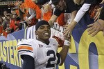 ATLANTA - DECEMBER 04:  Quarterback Cam Newton #2 of the Auburn Tigers celebrates with the crowd after the 2010 SEC Championship against the South Carolina Gamecocks at Georgia Dome on December 4, 2010 in Atlanta, Georgia.  The Tigers beat the Gamecocks 56-17.  (Photo by Mike Zarrilli/Getty Images)