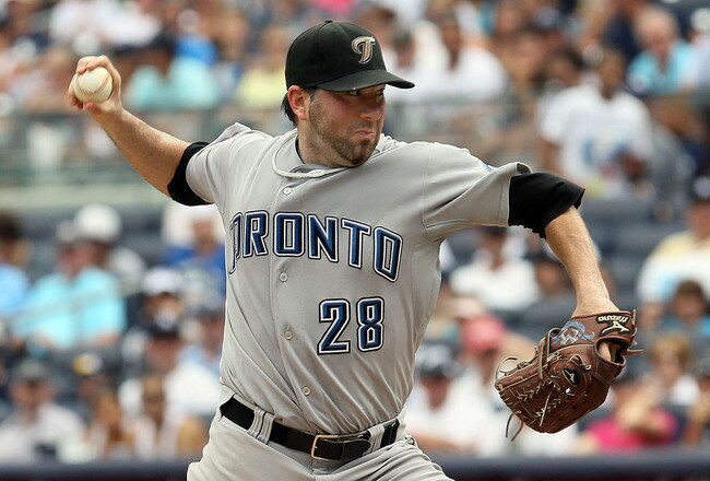 NEW YORK - AUGUST 04:  Shaun Marcum #28 of the Toronto Blue Jays delivers a pitch against the New York Yankees on August 4, 2010 at Yankee Stadium in the Bronx borough of New York City.  (Photo by Jim McIsaac/Getty Images)