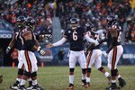 CHICAGO - NOVEMBER 28: Jay Cutler #6 of the Chicago Bears congratulates teammates (L-R) Chris Williams #74, Roberto Garza #63 and Frank Omiyale #68 after a touchdown throw against the Philadelphia Eagles at Soldier Field on November 28, 2010 in Chicago, Illinois. The Bears defeated the Eagles 31-26. (Photo by Jonathan Daniel/Getty Images)