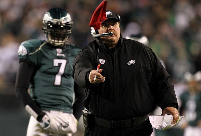 PHILADELPHIA, PA - DECEMBER 02:  Head coach Andy Reid of the Philadelphia Eagles throws the red challenge flag on a play involving Brent Celek #87 in the second half as Michael Vick #7 looks on against the Houston Texans at Lincoln Financial Field on December 2, 2010 in Philadelphia, Pennsylvania.  (Photo by Al Bello/Getty Images)