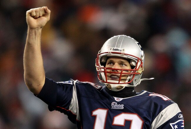 FOXBORO, MA - DECEMBER 06:  Tom Brady #12 of the New England Patriots celebrates after BenJarvus Green-Ellis #42 scored a 5-yard rushing touchdown in the fourth quarter against the New York Jets at Gillette Stadium on December 6, 2010 in Foxboro, Massachusetts.  (Photo by Elsa/Getty Images)
