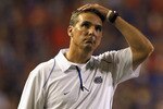 GAINESVILLE, FL - OCTOBER 09:  Head coach Urban Meyer of the Florida Gators puts his hand on his head during the game against the Louisiana State University Tigers at Ben Hill Griffin Stadium on October 9, 2010 in Gainesville, Florida.  (Photo by Sam Greenwood/Getty Images)