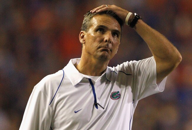 GAINESVILLE, FL - OCTOBER 09:  Head coach Urban Meyer of the Florida Gators puts his hand on his head during the game against the Louisiana State University Tigers at Ben Hill Griffin Stadium on October 9, 2010 in Gainesville, Florida.  (Photo by Sam Greenwood/Getty Images)
