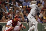 BOSTON - SEPTEMBER 07:  Carl Crawford #13 of the Tampa Bay Rays hits a 2 RBI double in the fourth inning as Victor Martinez #41 of the Boston Red Sox catches on September 7, 2010 at Fenway Park in Boston, Massachusetts.  (Photo by Elsa/Getty Images)