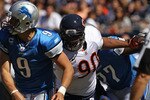 CHICAGO - SEPTEMBER 12: Julius Peppers #90 of the Chicago Bears pressures Matthew Stafford #9 of the Detroit Lions during the NFL season opening game at Soldier Field on September 12, 2010 in Chicago, Illinois. The Bears defeated the Lions 19-14. (Photo by Jonathan Daniel/Getty Images)