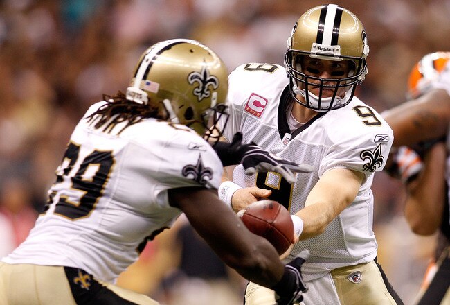 NEW ORLEANS - OCTOBER 24:  Drew Brees #9 hands off the ball to Chris Ivory #29 of the New Orleans Saints during the game against the Cleveland Browns at the Louisiana Superdome on October 24, 2010 in New Orleans, Louisiana.  The Browns defeated the Saints 30-17.  (Photo by Chris Graythen/Getty Images)