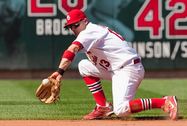 ST. LOUIS - MAY 22: Brendan Ryan #13 of the St. Louis Cardinals fields a ground ball against the Los Angeles Angels of Anaheim at Busch Stadium on May 22, 2010 in St. Louis, Missouri.  The Angels beat the Cardinals 10-7.  (Photo by Dilip Vishwanat/Getty Images)