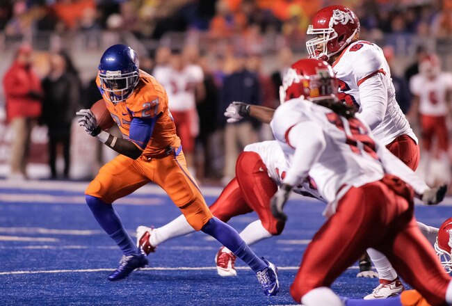 BOISE, ID - NOVEMBER 19:  Jeremy Avery #27 of the Boise State Broncos runs the ball against the Fresno State Bulldogs at Bronco Stadium on November 19, 2010 in Boise, Idaho.  (Photo by Otto Kitsinger III/Getty Images)