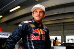 HOMESTEAD, FL - NOVEMBER 20:  Scott Speed, driver of the #82 Red Bull Toyota, stands in the garage during practice for the NASCAR Sprint Cup Series Ford 400 at Homestead-Miami Speedway on November 20, 2010 in Homestead, Florida.  (Photo by Jason Smith/Getty Images for NASCAR)