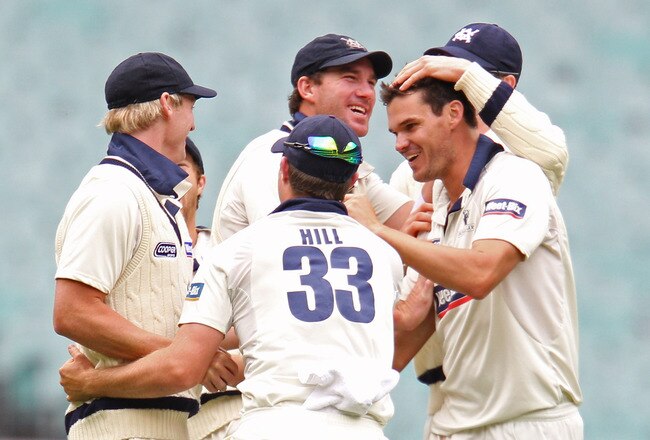 MELBOURNE, AUSTRALIA - DECEMBER 12:  Clint McKay of Victoria celebrates with his team mates after dismissing Steve Davies of England during day three of the Tour Match between the Victorian Bushrangers and England at Melbourne Cricket Ground on December 12, 2010 in Melbourne, Australia.  (Photo by Scott Barbour/Getty Images)