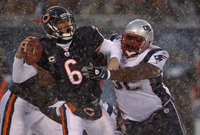 CHICAGO - DECEMBER 12: Jay Cutler #6 of the Chicago Bears is sacked by Gerard Warren #92 of the New England Patriots at Soldier Field on December 12, 2010 in Chicago, Illinois. (Photo by Jonathan Daniel/Getty Images)