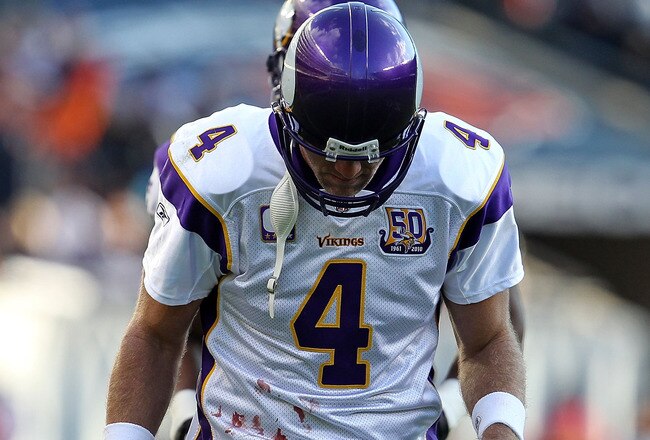 CHICAGO - NOVEMBER 14: Brett Favre #4 of the Minnesota Vikings walks back to the field of play from the sidelines during a game against the Chicago Bears at Soldier Field on November 14, 2010 in Chicago, Illinois. The Bears defeated the Vikings 27-13. (Photo by Jonathan Daniel/Getty Images)