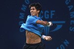 DELHI, INDIA - OCTOBER 10:  Gold medal winner Somdev Devvarman of India plays a forehand against Greg Jones of Australia during the men's singles final at RK Khanna Tennis Stadium during day seven of the Delhi 2010 Commonwealth Games on October 10, 2010 in Delhi, India.  (Photo by Daniel Berehulak/Getty Images)