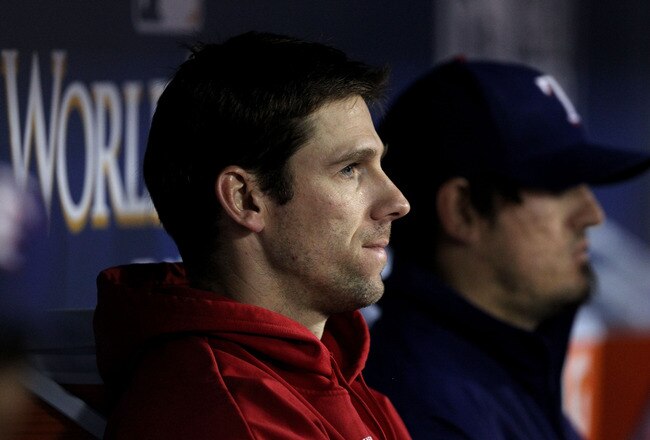 ARLINGTON, TX - NOVEMBER 01:  Losing pitcher Cliff Lee #33 of the Texas Rangers looks on from the dugout against the San Francisco Giants in Game Five of the 2010 MLB World Series at Rangers Ballpark in Arlington on November 1, 2010 in Arlington, Texas.  (Photo by Ronald Martinez/Getty Images)