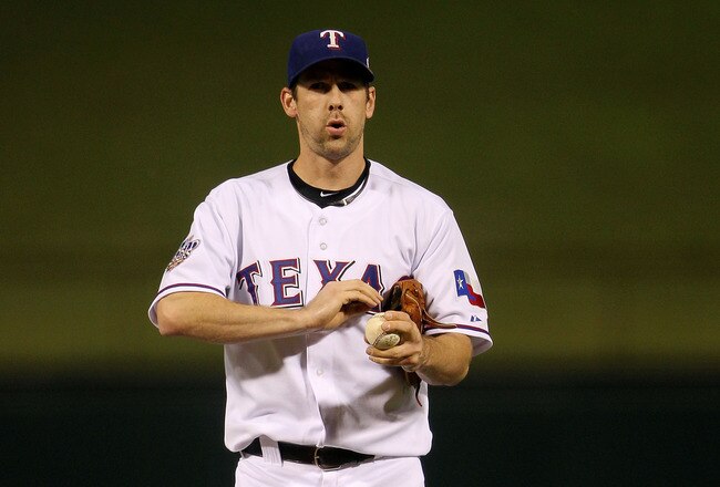 ARLINGTON, TX - NOVEMBER 01:  Cliff Lee #33 of the Texas Rangers pitches gets set to throw a pitch against the San Francisco Giants in Game Five of the 2010 MLB World Series at Rangers Ballpark in Arlington on November 1, 2010 in Arlington, Texas.  (Photo by Doug Pensinger/Getty Images)