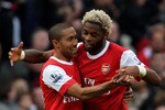 LONDON, ENGLAND - OCTOBER 30:  Alex Song of Arsenal is congratulated on scoring by team mate Gael Clichy during the Barclays Premier League match between Arsenal and West Ham United at Emirates Stadium on October 30, 2010 in London, England.  (Photo by Clive Rose/Getty Images)