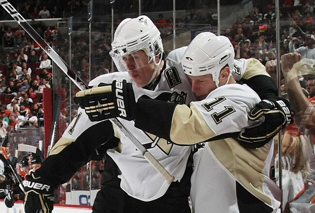 PHILADELPHIA - OCTOBER 08: Evgeni Malkin #71 (L) of the Pittsburgh Penguins hugs Jordan Staal #11 (R) after Staal's goal at 11:21 of the first period against the Philadelphia Flyers at the Wachovia Center on October 8, 2009 in Philadelphia, Pennsylvania.  (Photo by Bruce Bennett/Getty Images)