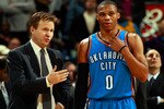 NEW ORLEANS, LA - DECEMBER 10:  Head coach Scott Brooks talks with Russell Westbrook #0 of the Oklahoma City Thunder during the game against the New Orleans Hornets at New Orleans Arena on December 10, 2010 in New Orleans, Louisiana.    NOTE TO USER: User expressly acknowledges and agrees that, by downloading and/or using this photograph, User is consenting to the terms and conditions of the Getty Images License Agreement.  (Photo by Chris Graythen/Getty Images)
