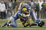DETROIT, MI - DECEMBER 12: Andrew Quarless #81 of the Green Bay Packers is tackled by DeAndre Levy #54 and Prince Miller #38 of the Detroit Lions on December 12, 2010 at Ford Field in Detroit, Michigan. Detroit won the game 7-3. (Photo by Gregory Shamus/Getty Images)