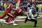 HOUSTON, TX - DECEMBER 13:  Wide receiver Derrick Mason #85 of the Baltimore Ravens scores in the first half against the Houston Texans as linebacker Kevin Bentley #57 and Troy Nolan #33 of the Houston Texans are late defending at Reliant Stadium on December 13, 2010 in Houston, Texas.  (Photo by Bob Levey/Getty Images)