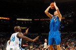 NEW ORLEANS - NOVEMBER 17:  Dirk Nowitzki #41 of the Dallas Mavericks shoots the ball over Emeka Okafor #50 of the New Orleans Hornets at the New Orleans Arena on November 17, 2010 in New Orleans, Louisiana.  The Hornets defeated the Mavericks 99-97.  NOTE TO USER: User expressly acknowledges and agrees that, by downloading and/or using this photograph, User is consenting to the terms and conditions of the Getty Images License Agreement.  (Photo by Chris Graythen/Getty Images)