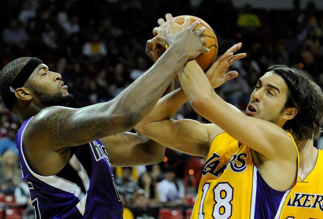 LAS VEGAS - OCTOBER 13:  DeMarcus Cousins #15 of the Sacramento Kings and Sasha Vujacic #18 of the Los Angeles Lakers fight for a rebound during their preseason game at the Thomas & Mack Center October 13, 2010 in Las Vegas, Nevada. The Lakers won 98-95. NOTE TO USER: User expressly acknowledges and agrees that, by downloading and/or using this Photograph, user is consenting to the terms and conditions of the Getty Images License Agreement.  (Photo by Ethan Miller/Getty Images)