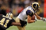 NEW ORLEANS, LA - DECEMBER 12:  Danny Amendola #16 of the St. Louis Rams is tackled by Roman Harper #41 of the New Orleans Saints at the Louisiana Superdome on December 12, 2010 in New Orleans, Louisiana. The Saints defeated the Rams 31-13.  (Photo by Chris Graythen/Getty Images)