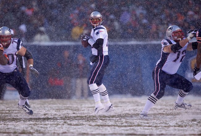 CHICAGO, IL - DECEMBER 12: Tom Brady #12 of the New England Patriots passes against the Chicago Bears at Soldier Field on December 12, 2010 in Chicago, Illinois.  The Patriots beat the Bears 36-7.  (Photo by Dilip Vishwanat/Getty Images)