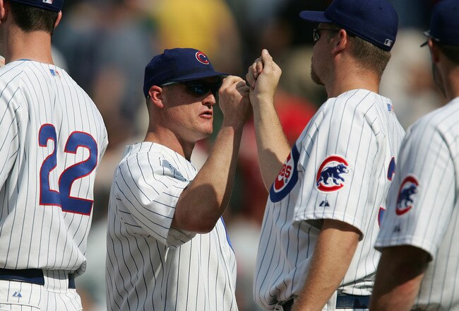 CHICAGO - JUNE 10:  Jeromy Burnitz #3 of the Chicago Cubs is congratulated by teammates Mark Prior #22 and Kerry Wood #34 after the Cubs defeated the Boston Red Sox 14-6 on June 10, 2005 at Wrigley Field in Chicago, Illinois.  (Photo by Jonathan Daniel/Getty Images)