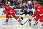 DETROIT, MI - NOVEMBER 17:  Todd Bertuzzi #44 of the Detroit Red Wings tries to keep the puck away from Jay McClement #18 of the St. Louis Blues in a game on November 17,2010 at the Joe Louis Arena in Detroit, Michigan. The Wings defeated the Blues 7-3. (Photo by Claus Andersen/Getty Images)