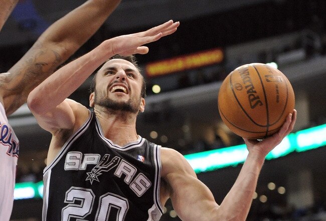 LOS ANGELES, CA - DECEMBER 01:  Manu Ginobili #20 of the San Antonio Spurs drives on DeAndre Jordan #9 of the Los Angeles Clippers during the game at the Staples Center on December 1, 2010 in Los Angeles, California.  NOTE TO USER: User expressly acknowledges and agrees that, by downloading and or using this photograph, User is consenting to the terms and conditions of the Getty Images License Agreement.  (Photo by Harry How/Getty Images)