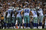 LANDOVER - SEPTEMBER 12:  The Dallas Cowboys offense huddles during the NFL season opener against the Washington Redskins at FedExField on September 12, 2010 in Landover, Maryland. The Redskins defeated the Cowboys 13-7. (Photo by Larry French/Getty Images)