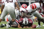 COLUMBIA, SC - SEPTEMBER 11: Quarterback Steven Garcia #5 of the South Carolina Gamecocks fumbles after being hit by defensive end Demarcus Dobbs #58 of the Georgia Bulldogs during the game at Williams-Brice Stadium on September 11, 2010 in Columbia, South Carolina. The Gamecocks beat the Bulldogs 17-6. (Photo by Mike Zarrilli/Getty Images)