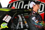 HOMESTEAD, FL - NOVEMBER 19:  Jeff Gordon, driver of the #24 DuPont Chevrolet, stands by his car in the garage during practice for the NASCAR Sprint Cup Series Ford 400 at Homestead-Miami Speedway on November 19, 2010 in Homestead, Florida.  (Photo by Chris Trotman/Getty Images for NASCAR)
