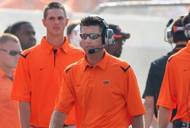 STILLWATER, OK - SEPTEMBER 05:  Head coach Mike Gundy of the Oklahoma State Cowboys walks the sidelines during the college football game against the Georgia Bulldogs at Boone Pickens Stadium on September 5, 2009 in Stillwater, Oklahoma.  The Cowboys defeated the Bulldogs 24-10.  (Photo by Christian Petersen/Getty Images)